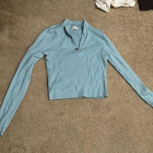 This is a tight Blue quarter Zip size L